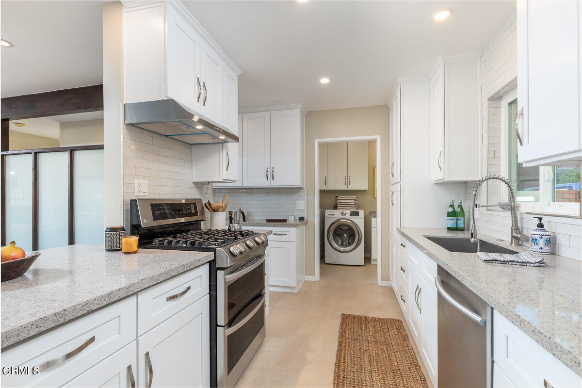 1376 Brixton Road Pasadena, CA 91105 - Photo 15 of 38 a kitchen with stainless steel appliances granite countertop a sink stove and refrigerator