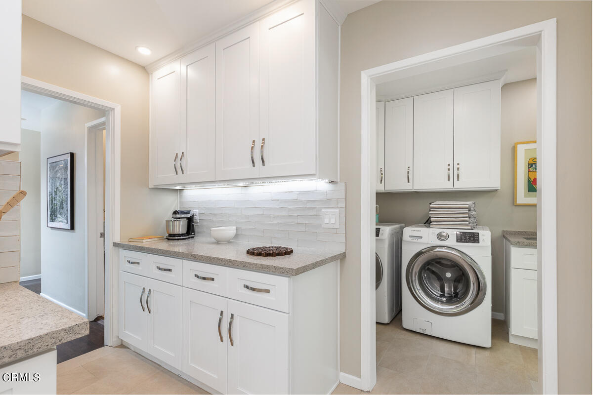 1376 Brixton Road Pasadena, CA 91105 - Photo 16 of 38 a utility room with cabinets washer and dryer