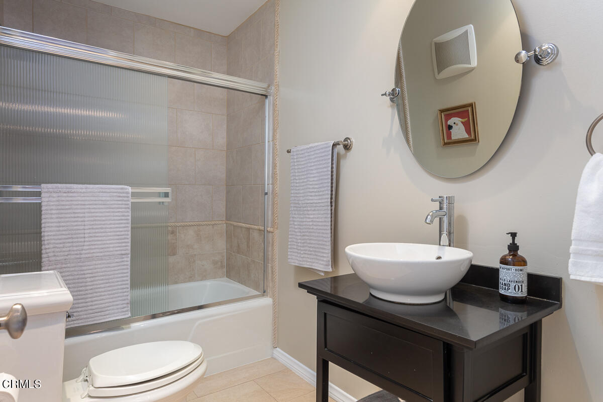 1376 Brixton Road Pasadena, CA 91105 - Photo 32 of 38 a bathroom with a sink a toilet and shower