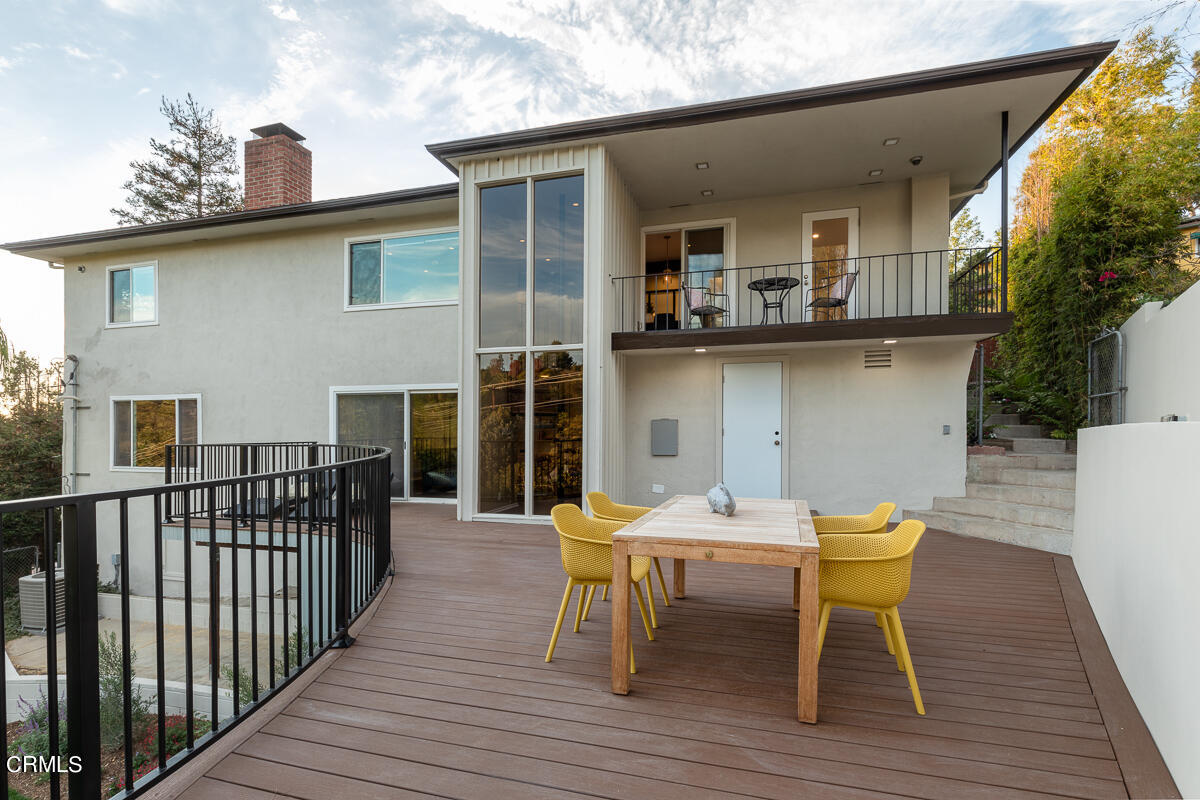 1376 Brixton Road Pasadena, CA 91105 - Photo 34 of 38 a view of a roof deck with table and chairs and wooden floor