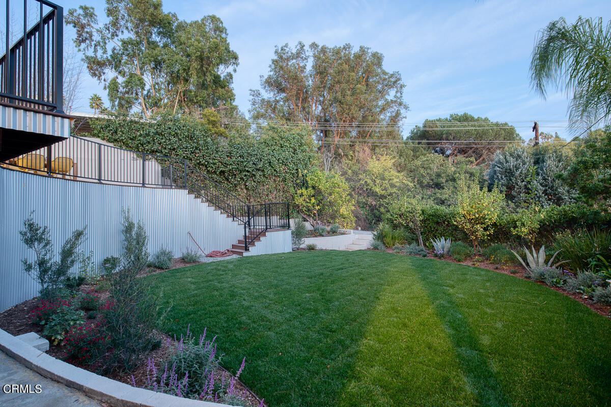 1376 Brixton Road Pasadena, CA 91105 - Photo 37 of 38 a view of a backyard with plants and palm tree