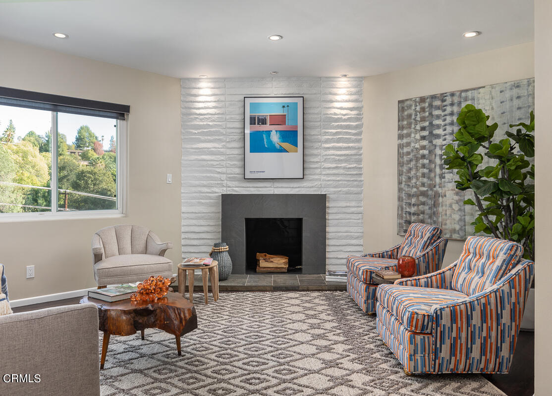 1376 Brixton Road Pasadena, CA 91105 - Photo 7 of 38 a living room with furniture and a fireplace