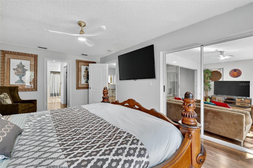 14520 Lost Lake Road Clermont, FL 34711 - Photo 20 of 47 a bedroom with a bed and a flat screen tv