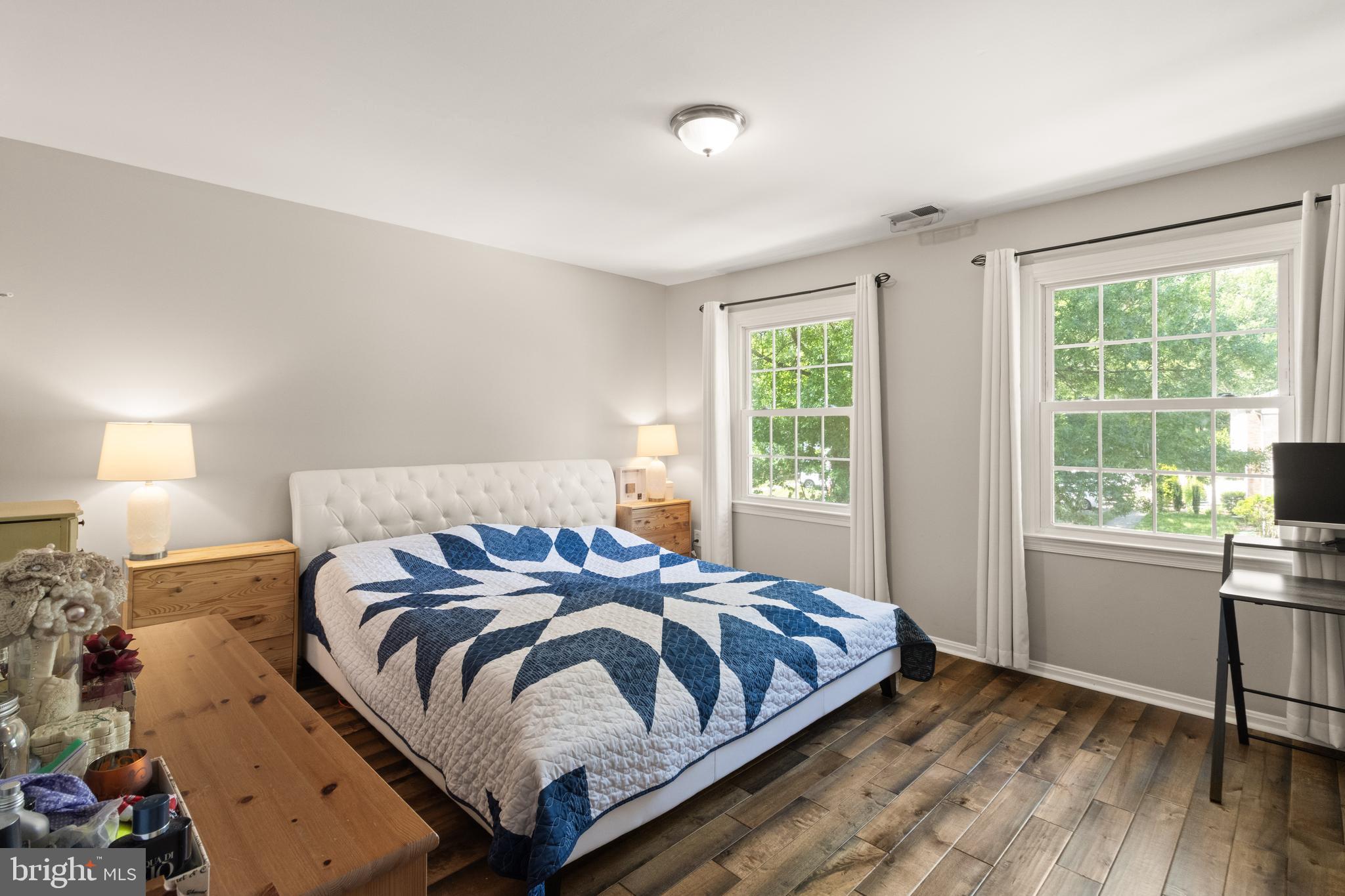 8573 Tyrolean Way Springfield, VA 22153 - Photo 13 of 32 a bedroom with a bed and a window