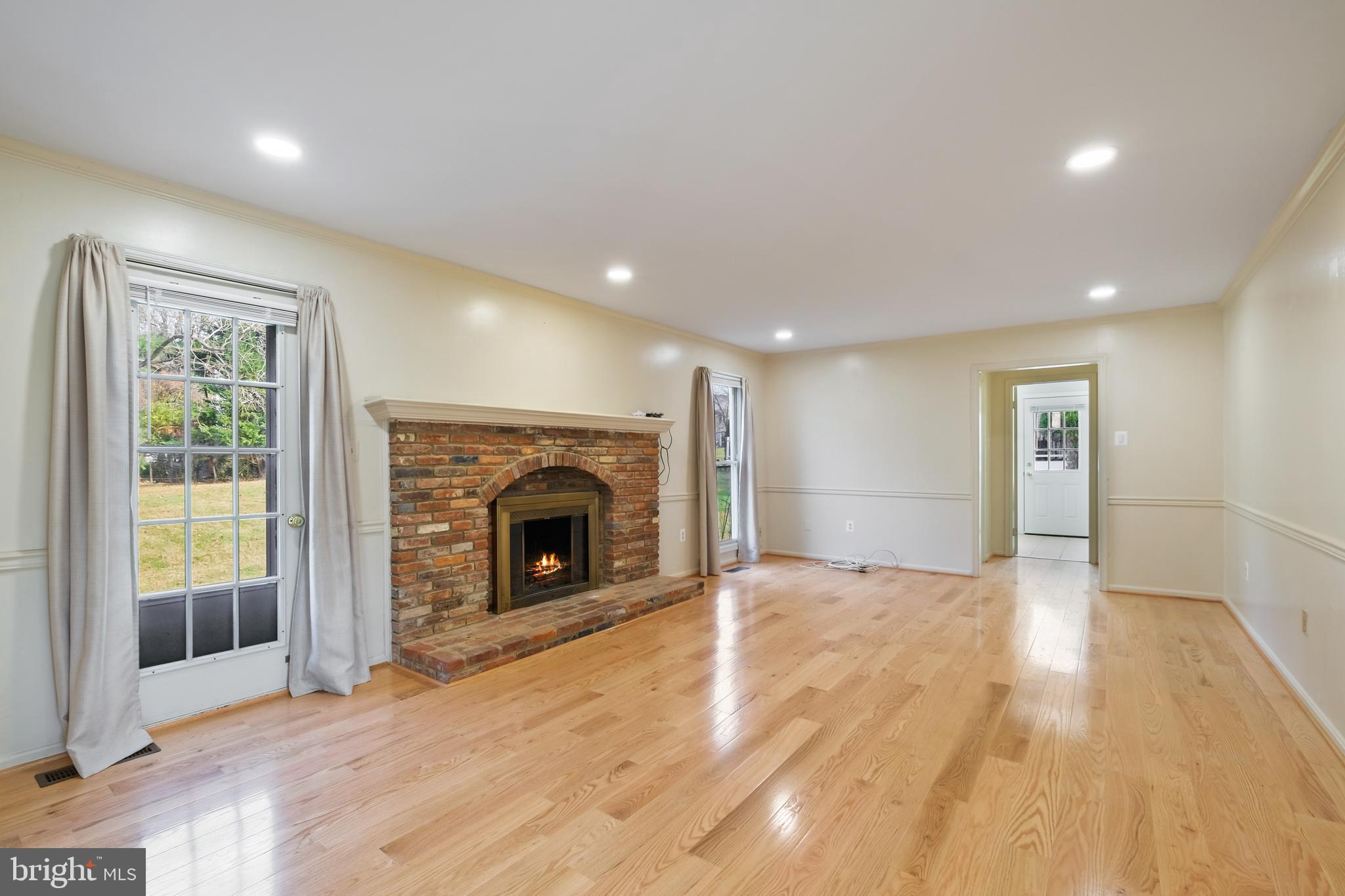 13905 Huxley Cove Court Silver Spring, MD 20906 - Photo 17 of 30 a view of an empty room with window and fire place