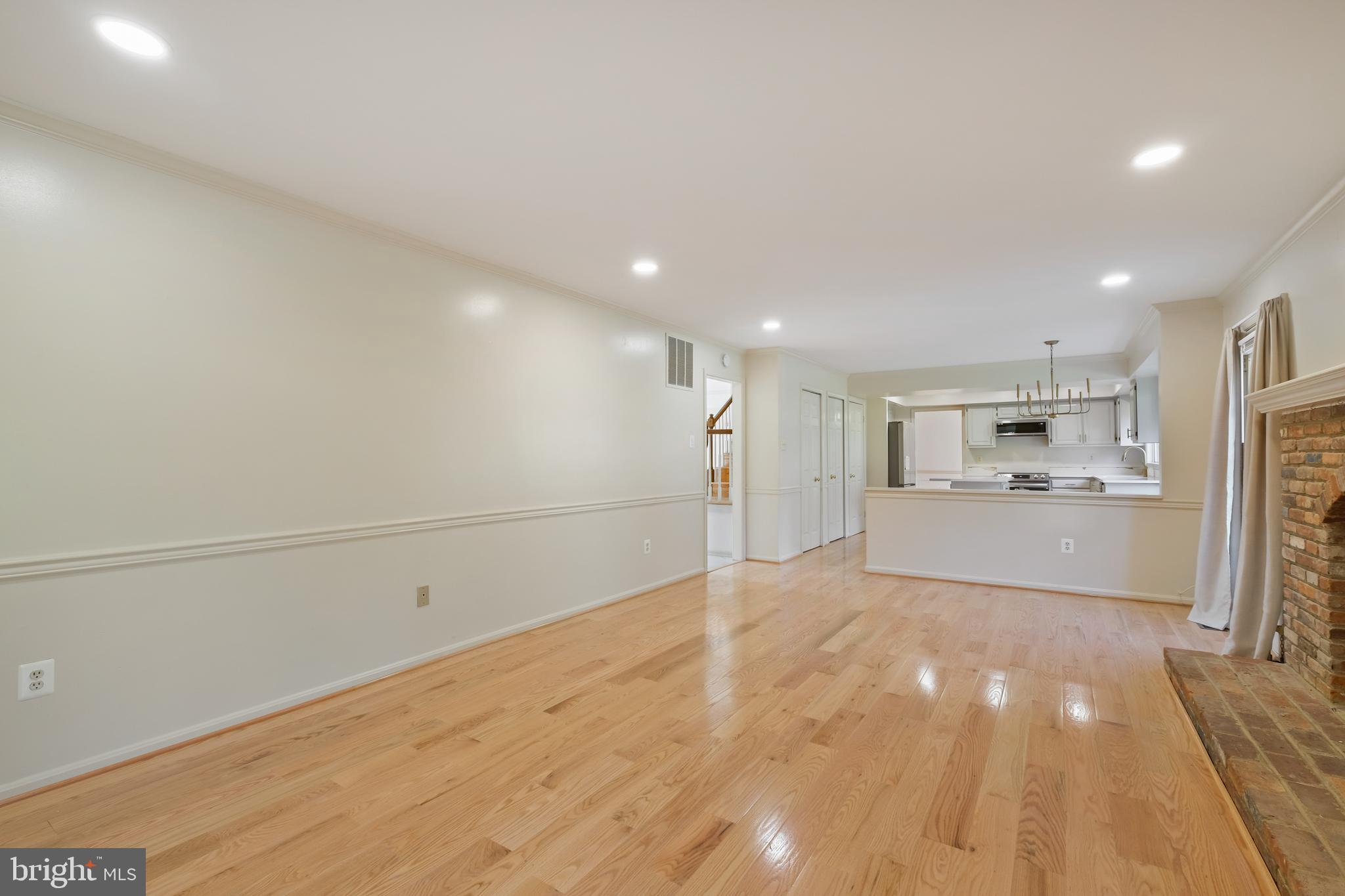 13905 Huxley Cove Court Silver Spring, MD 20906 - Photo 10 of 30 a view of a kitchen with a sink and a refrigerator
