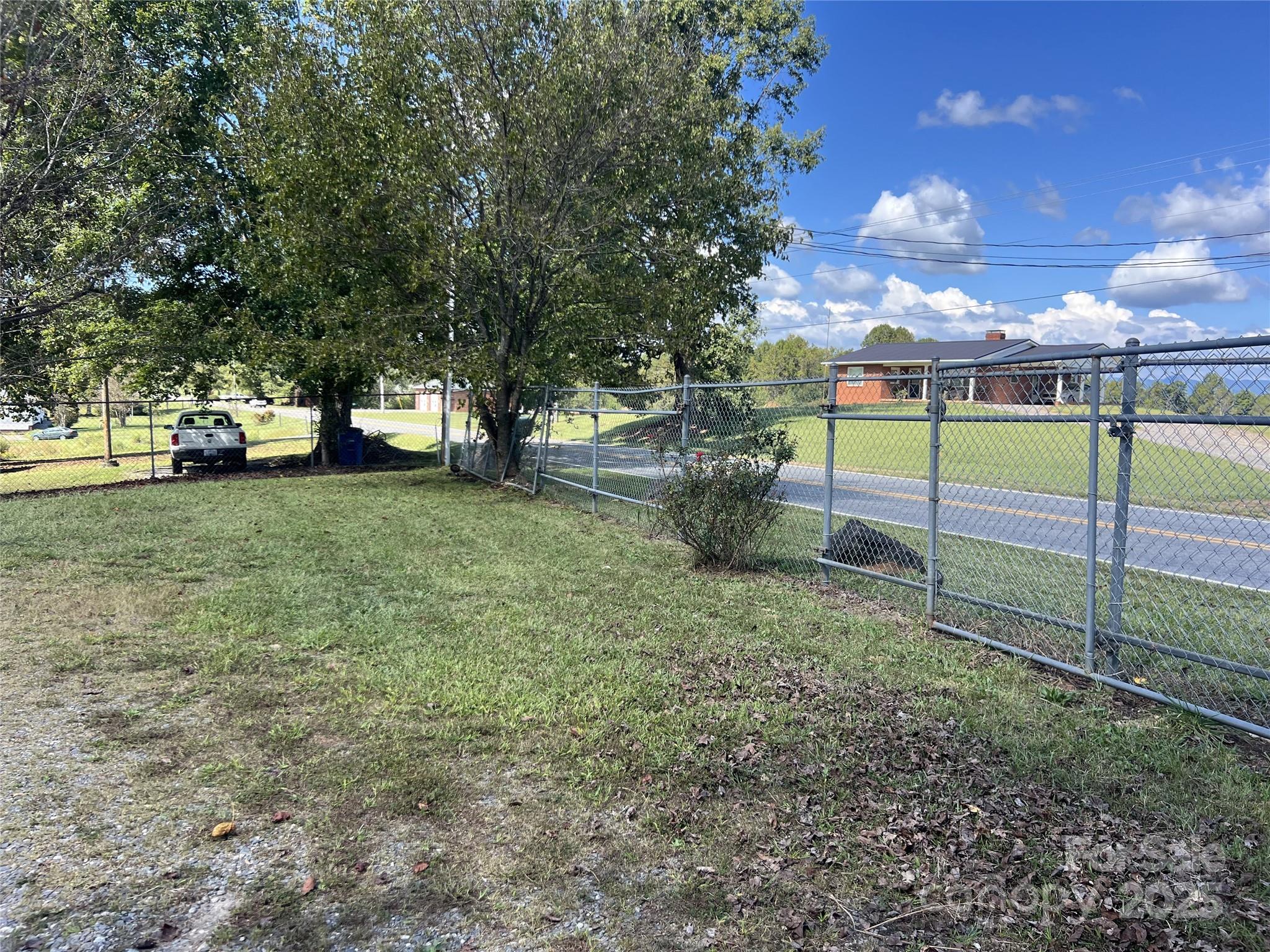3674-l R Lr Walker Road Morganton, NC 28655 - Photo 20 of 21 a view of a yard with a house in the background