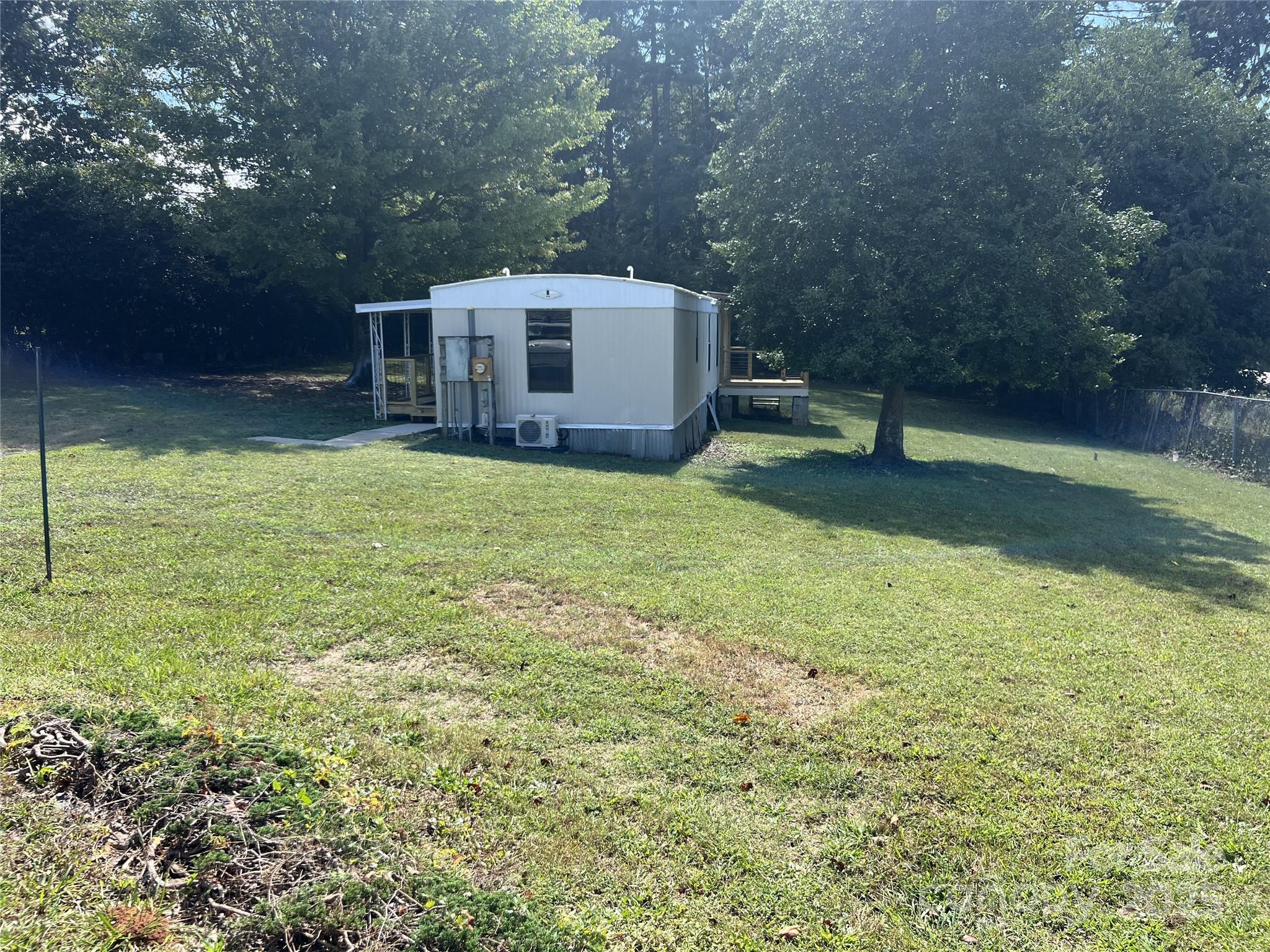 3674-l R Lr Walker Road Morganton, NC 28655 - Photo 21 of 21 a view of a backyard with a plants and trees