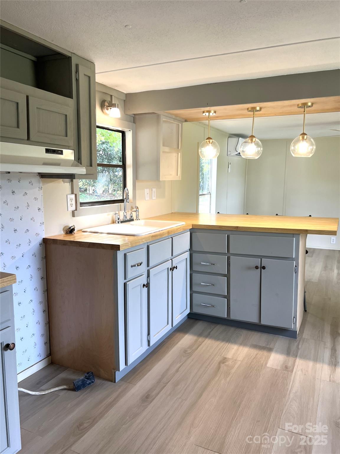 3674-l R Lr Walker Road Morganton, NC 28655 - Photo 4 of 21 a kitchen with stainless steel appliances granite countertop a sink stove and wooden floor
