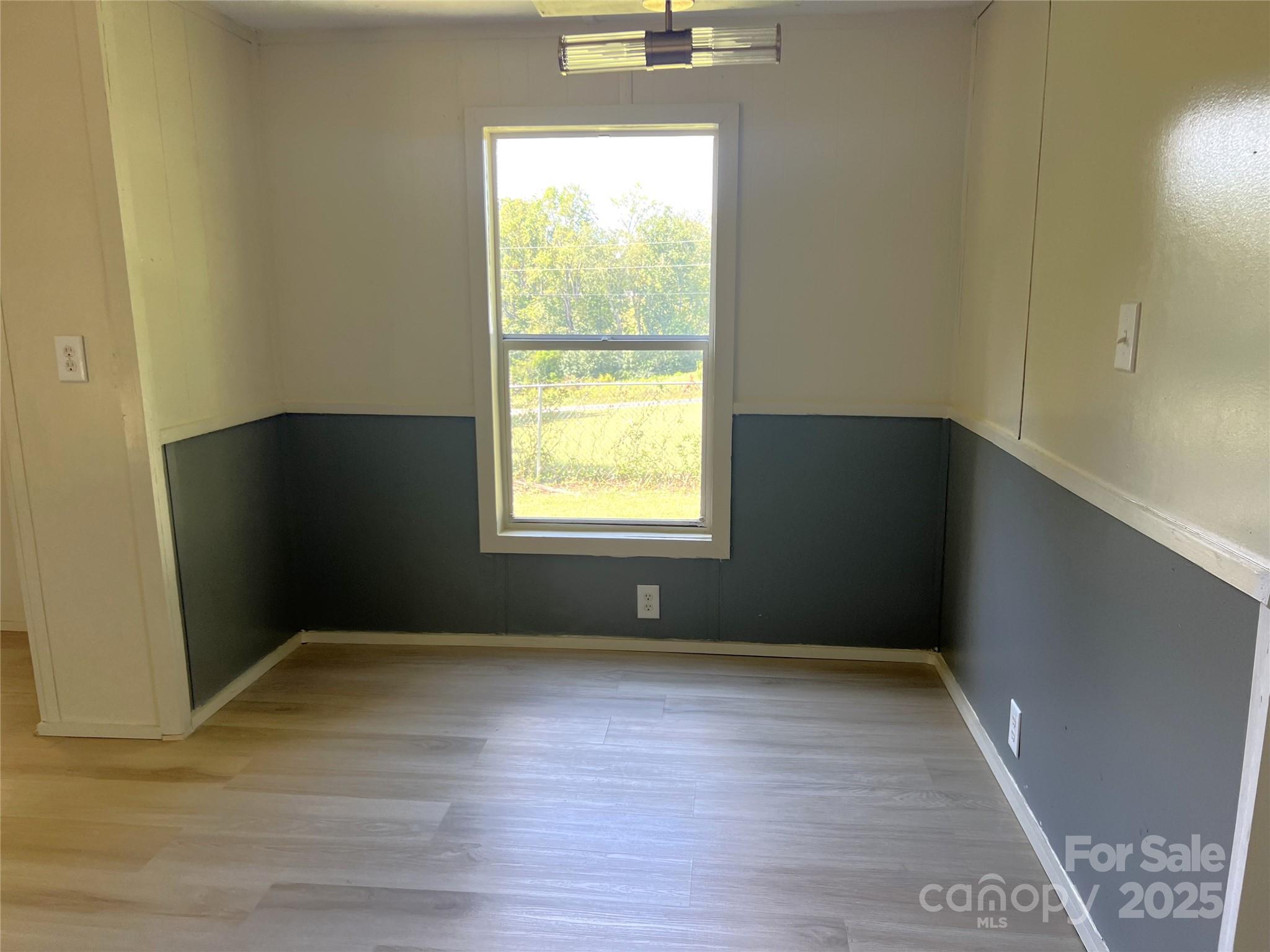 3674-l R Lr Walker Road Morganton, NC 28655 - Photo 5 of 21 an empty room with wooden floor and windows