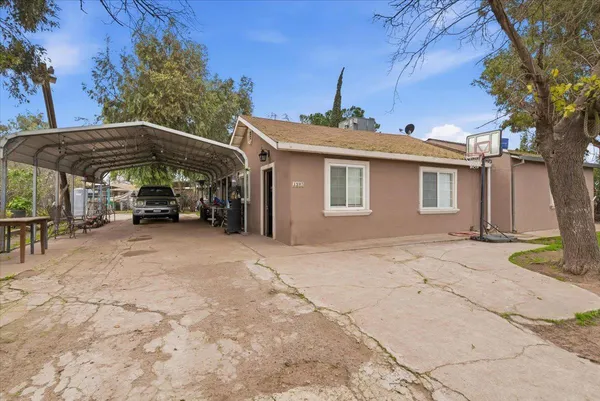a view of a car park in front of house