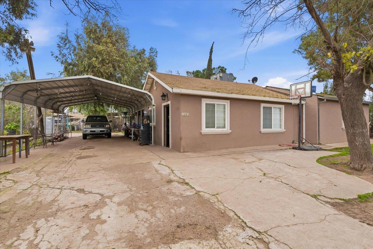 a view of a car park in front of house