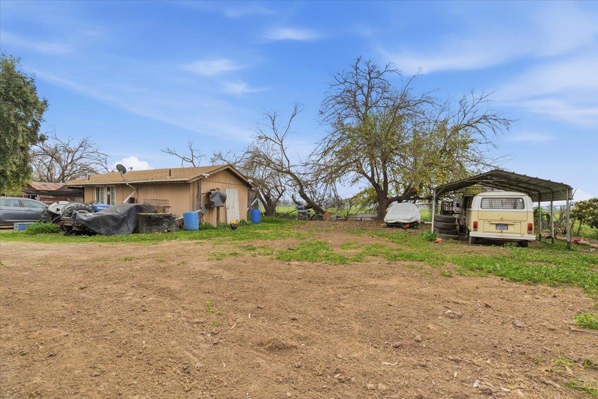 3902 Arch Road Stockton, CA 95215 - Photo 11 of 30 a front view of a house with a yard and garage