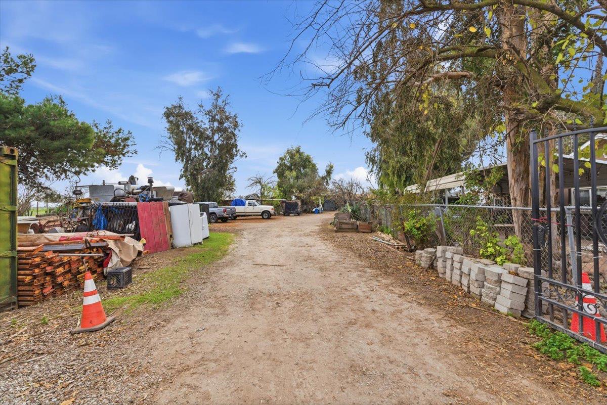 3902 Arch Road Stockton, CA 95215 - Photo 12 of 30 a view of street with wooden fence