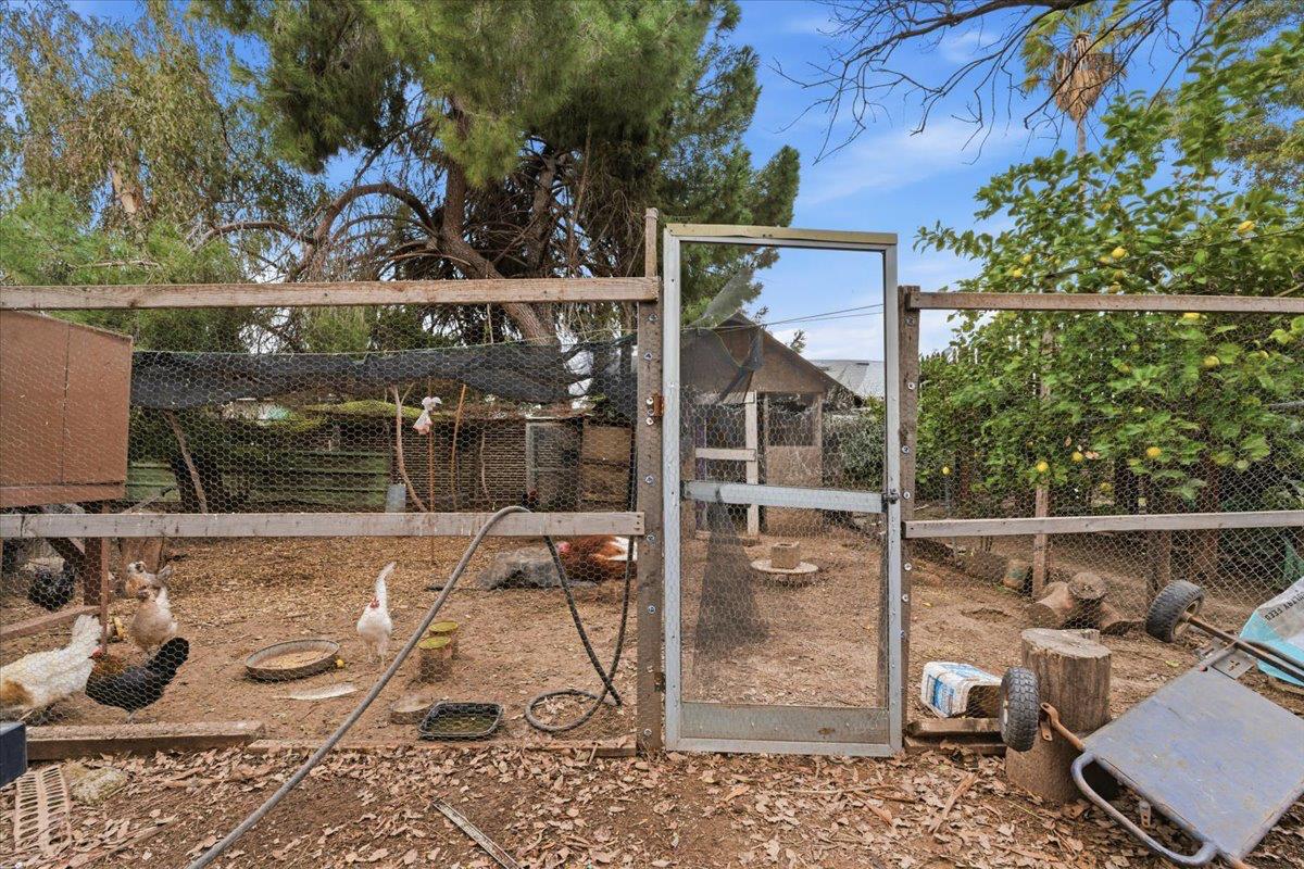 3902 Arch Road Stockton, CA 95215 - Photo 25 of 30 a view of a patio with table and chairs and potted plants