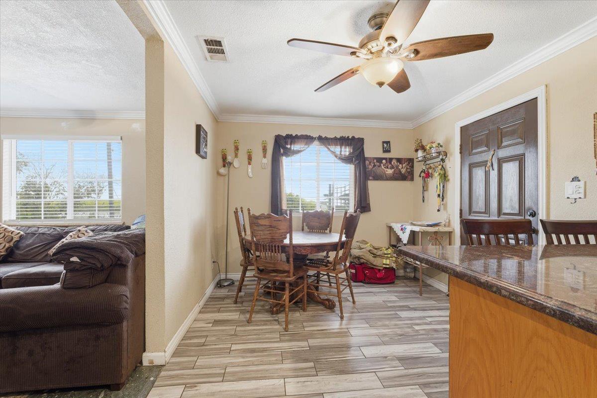 3902 Arch Road Stockton, CA 95215 - Photo 4 of 30 a living room with furniture and wooden floor