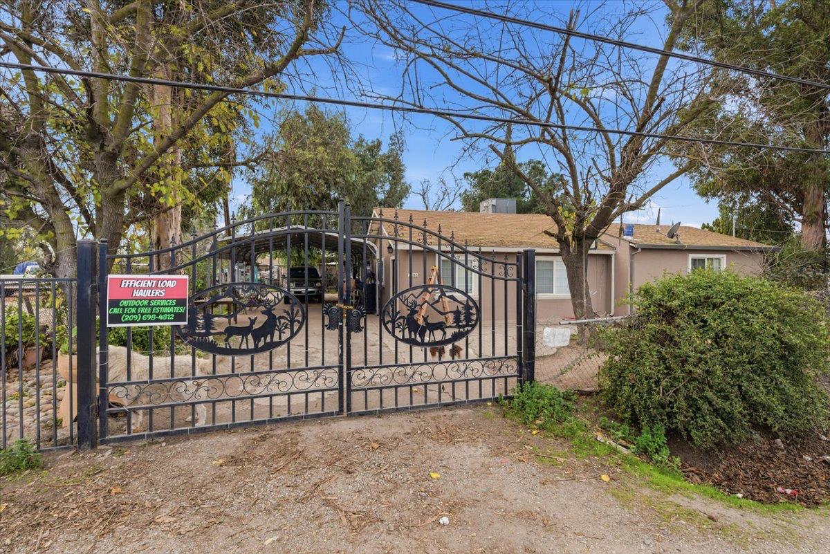 3902 Arch Road Stockton, CA 95215 - Photo 8 of 30 a view of a wrought iron fences in front of house