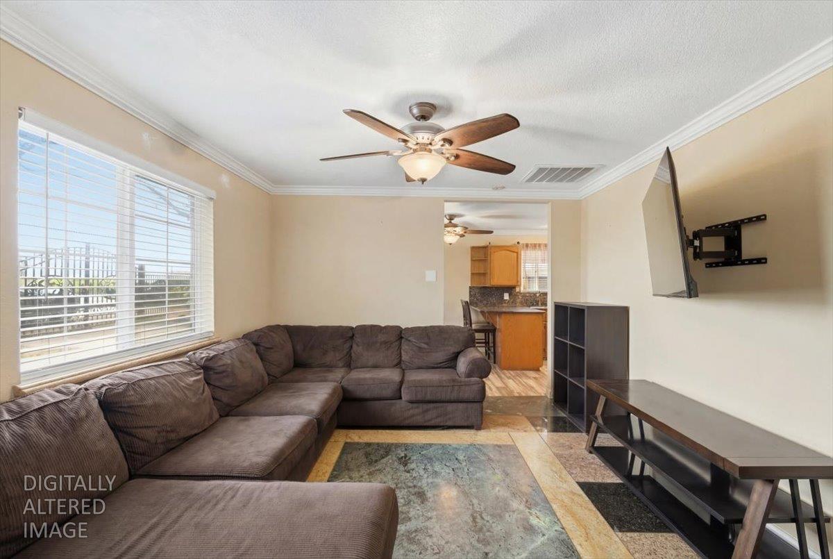 3902 Arch Road Stockton, CA 95215 - Photo 9 of 30 a living room with furniture and a window