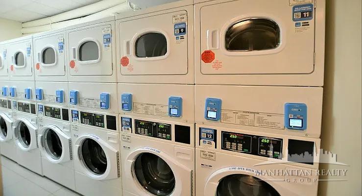 166 2nd Avenue, Unit 3M Manhattan, NY 10003 - Photo 7 of 7 a utility room with dryer and washer