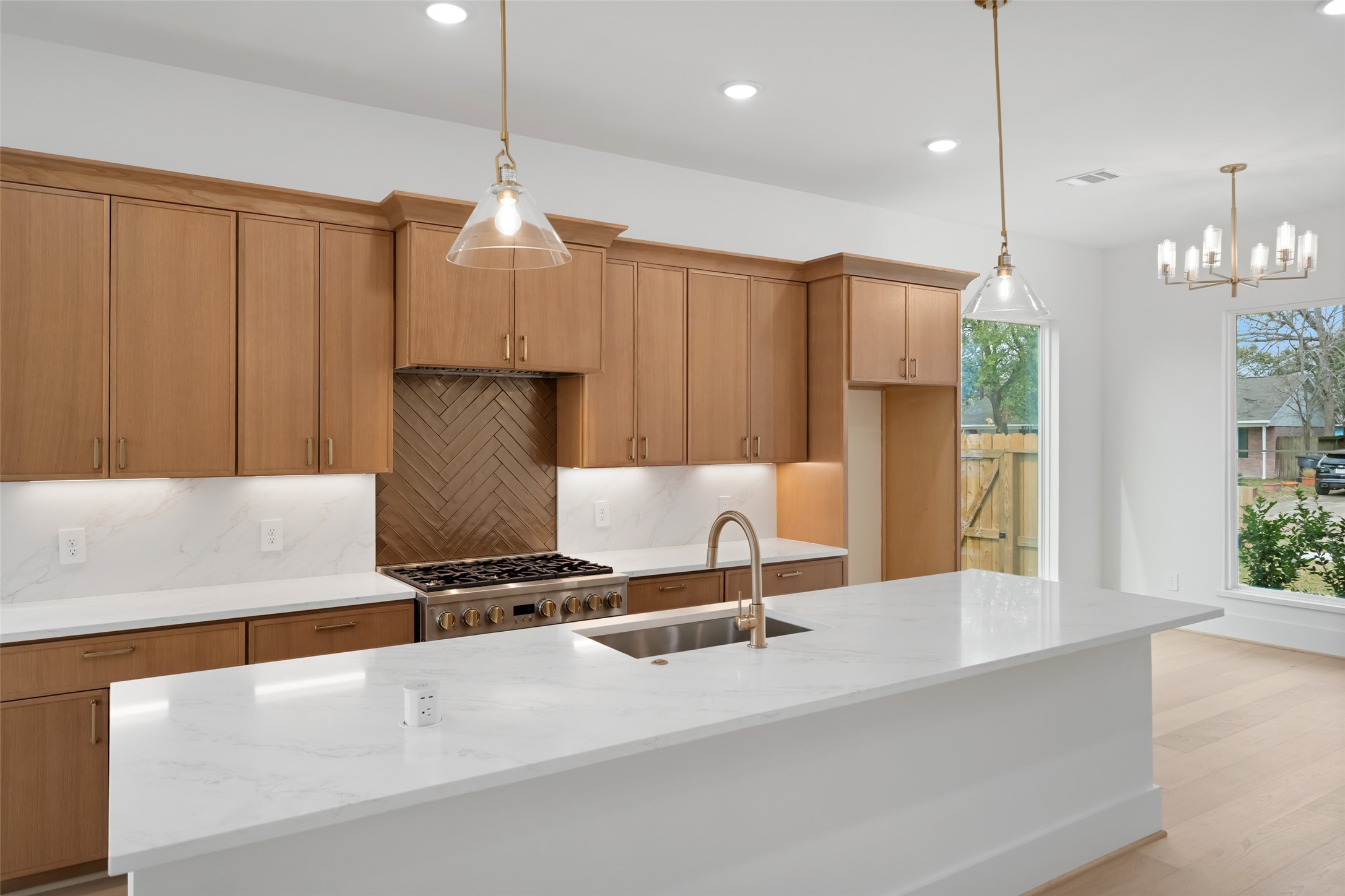 8521 Friendship Road Houston, TX 77080 - Photo 12 of 49 a view of kitchen with stainless steel appliances granite countertop cabinets and a chandelier