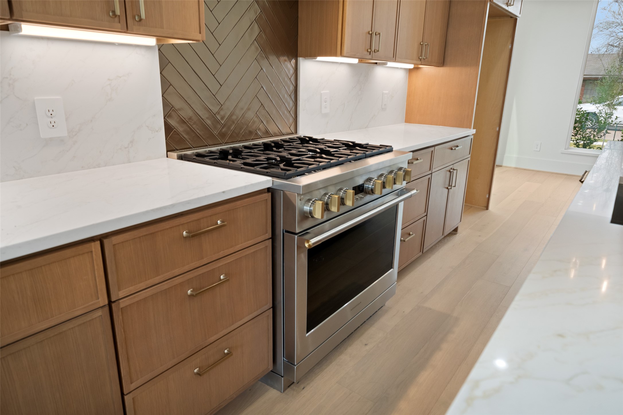 8521 Friendship Road Houston, TX 77080 - Photo 14 of 49 a kitchen with granite countertop a stove and a wooden floor