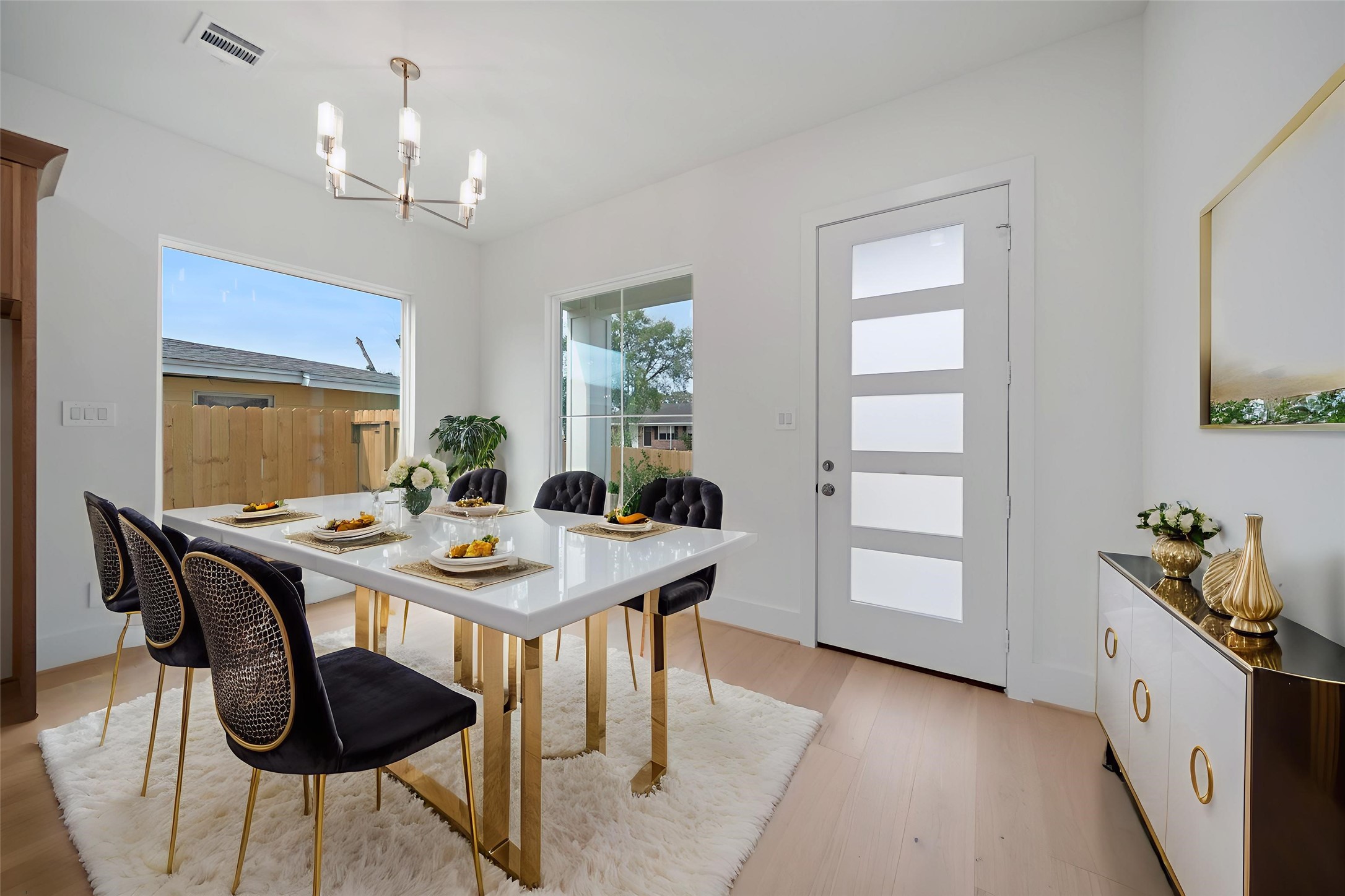 8521 Friendship Road Houston, TX 77080 - Photo 16 of 49 a view of a dining room with furniture and chandelier