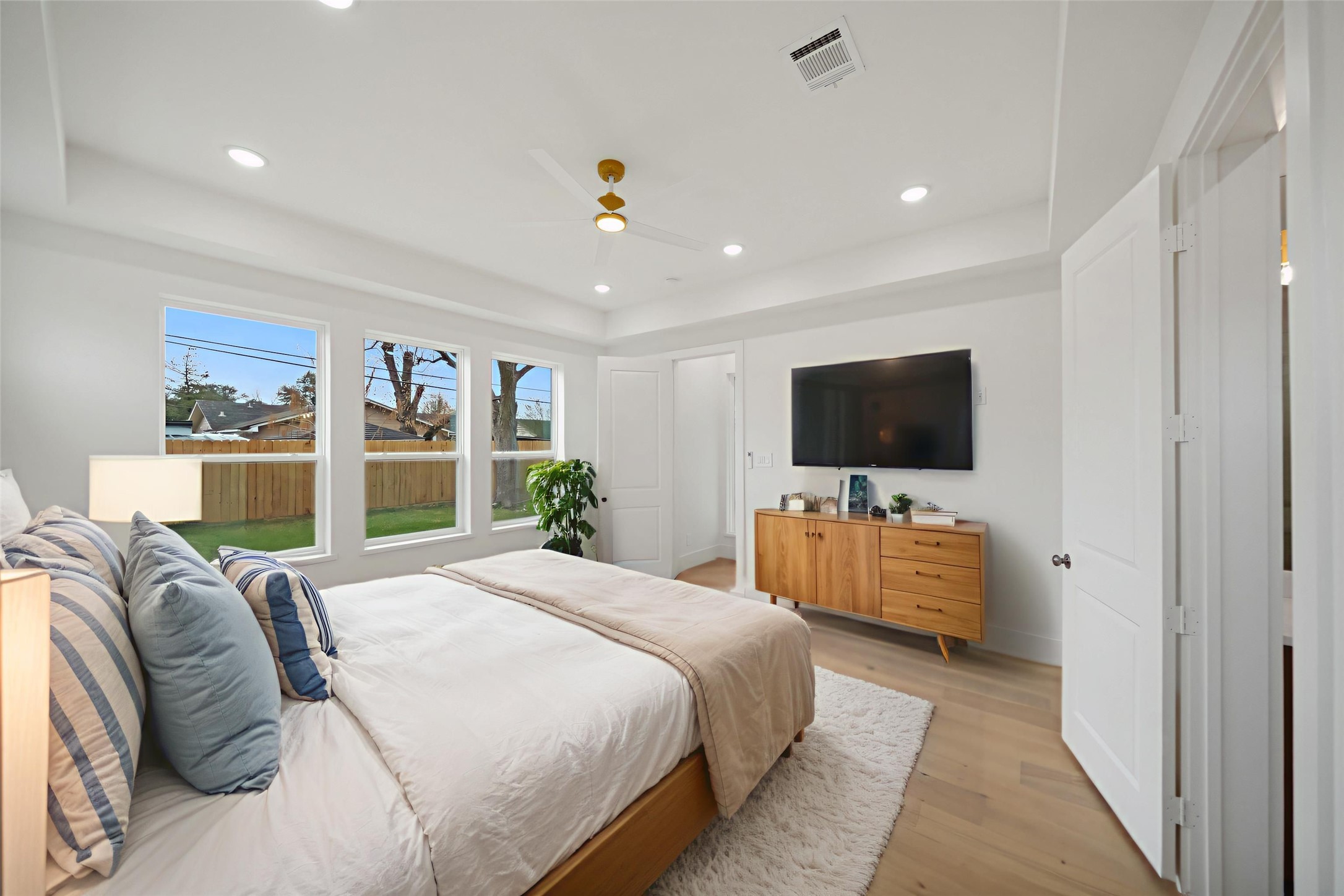 8521 Friendship Road Houston, TX 77080 - Photo 18 of 49 a bedroom with a bed and a flat screen tv