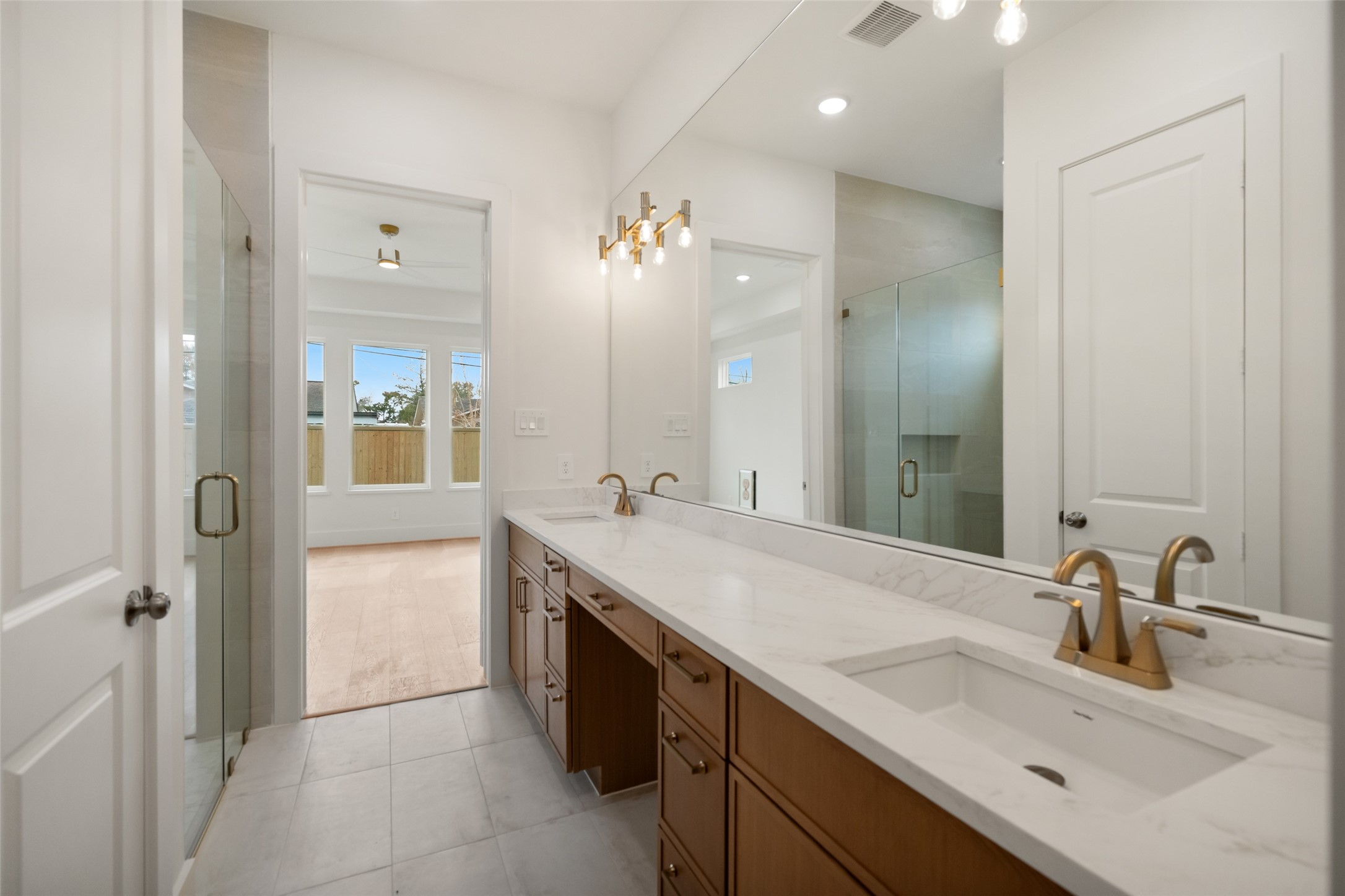 8521 Friendship Road Houston, TX 77080 - Photo 22 of 49 a bathroom with a sink double vanity and a mirror