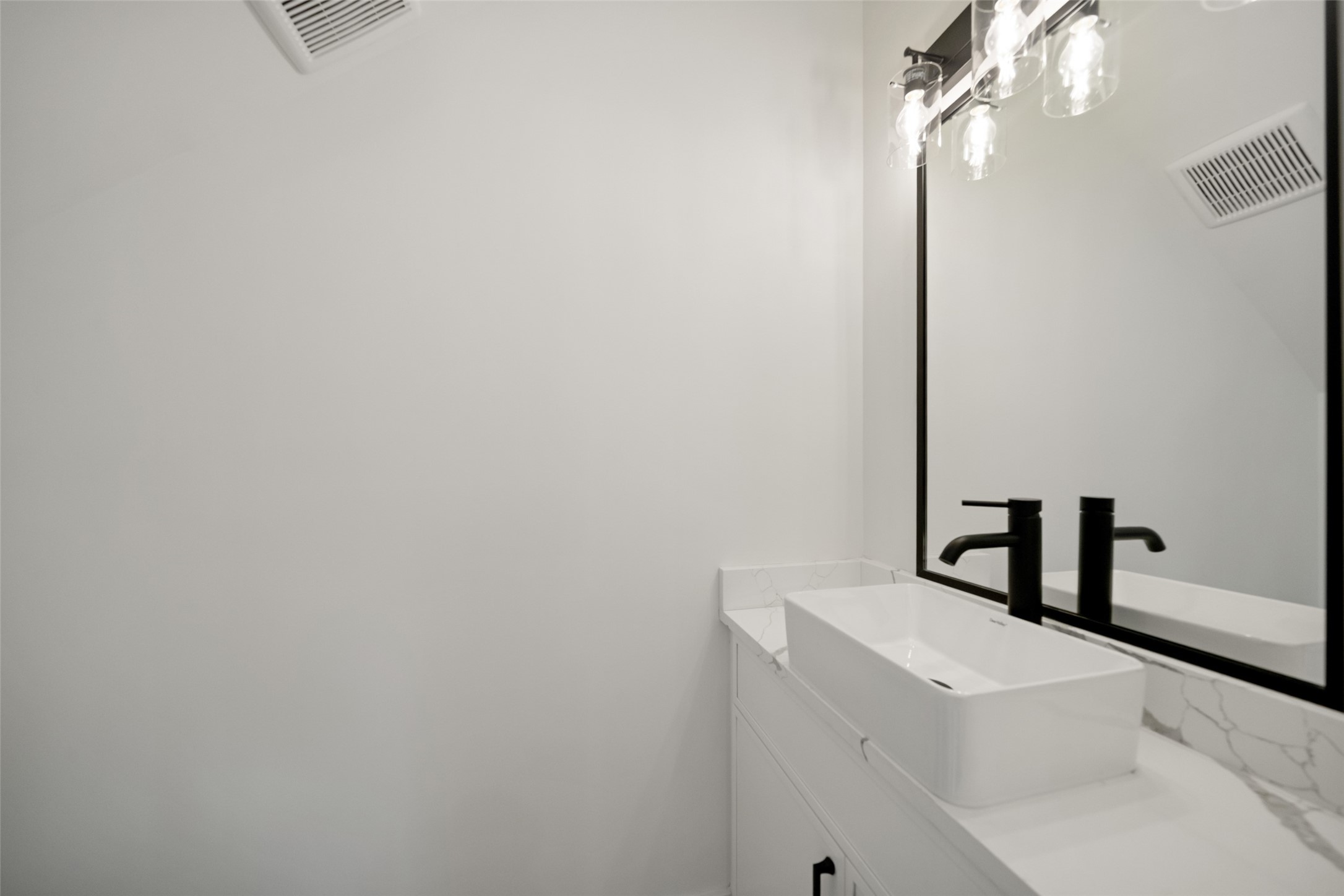 8521 Friendship Road Houston, TX 77080 - Photo 25 of 49 a bathroom with a sink and mirror