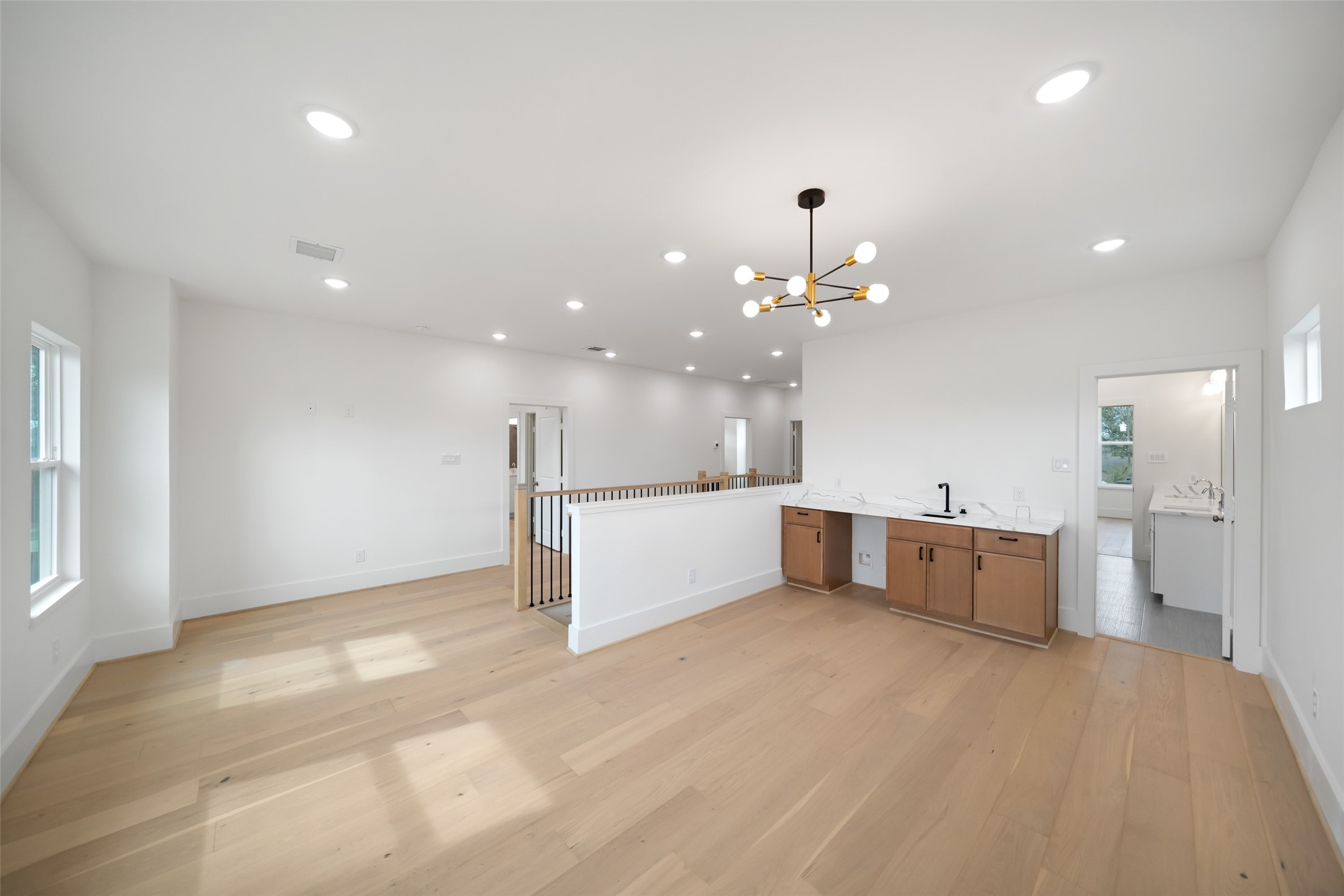 8521 Friendship Road Houston, TX 77080 - Photo 30 of 49 a large kitchen with a refrigerator a sink dishwasher with a dining table and chairs