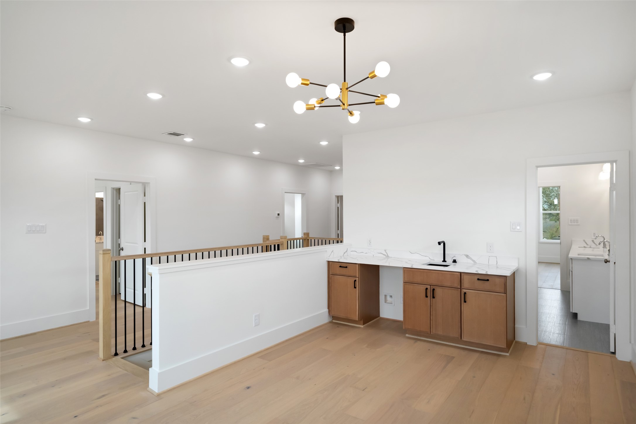8521 Friendship Road Houston, TX 77080 - Photo 31 of 49 a view of a kitchen with a sink dishwasher and wooden floor