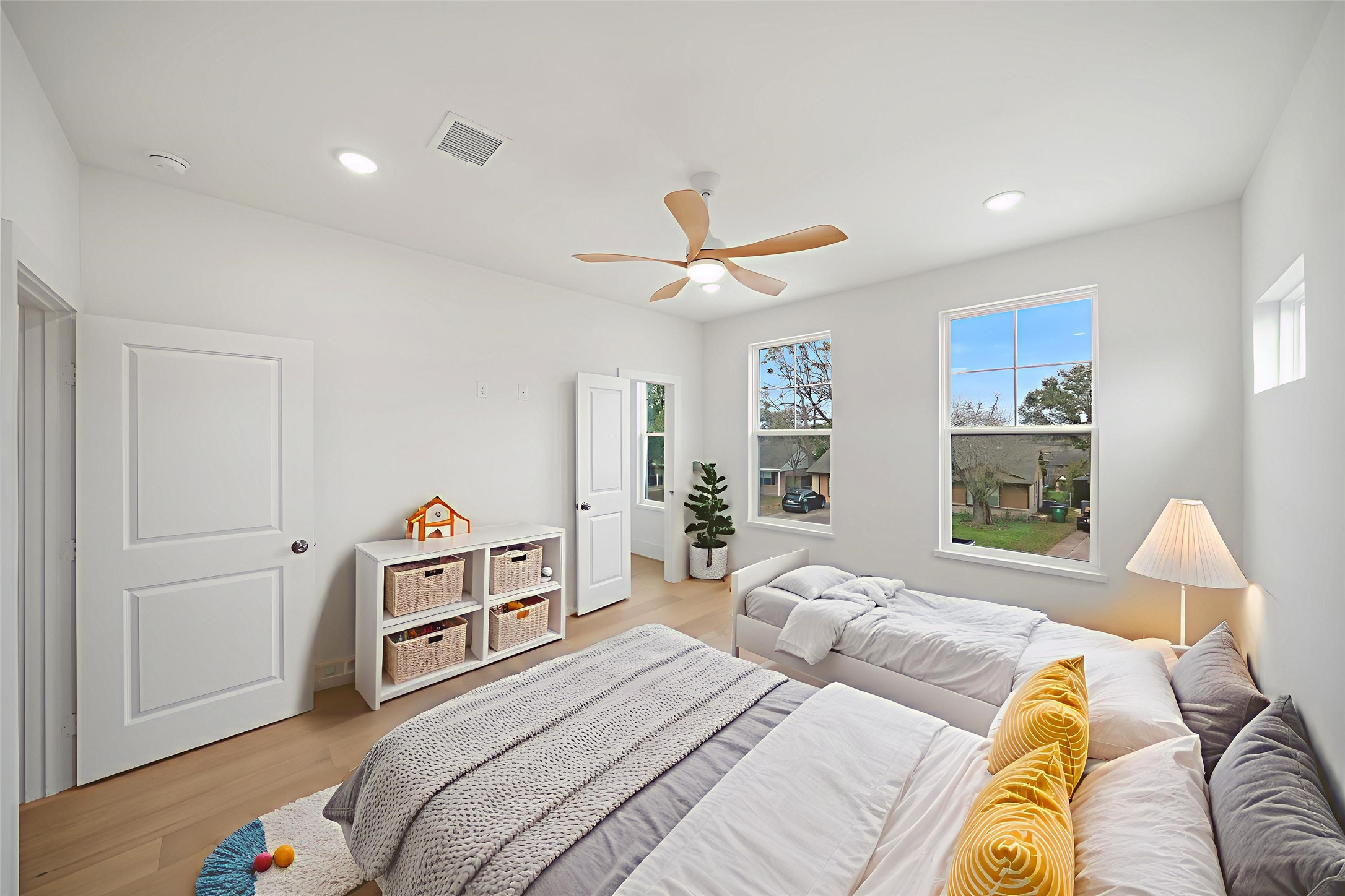 8521 Friendship Road Houston, TX 77080 - Photo 32 of 49 a bedroom with a bed and a chandelier