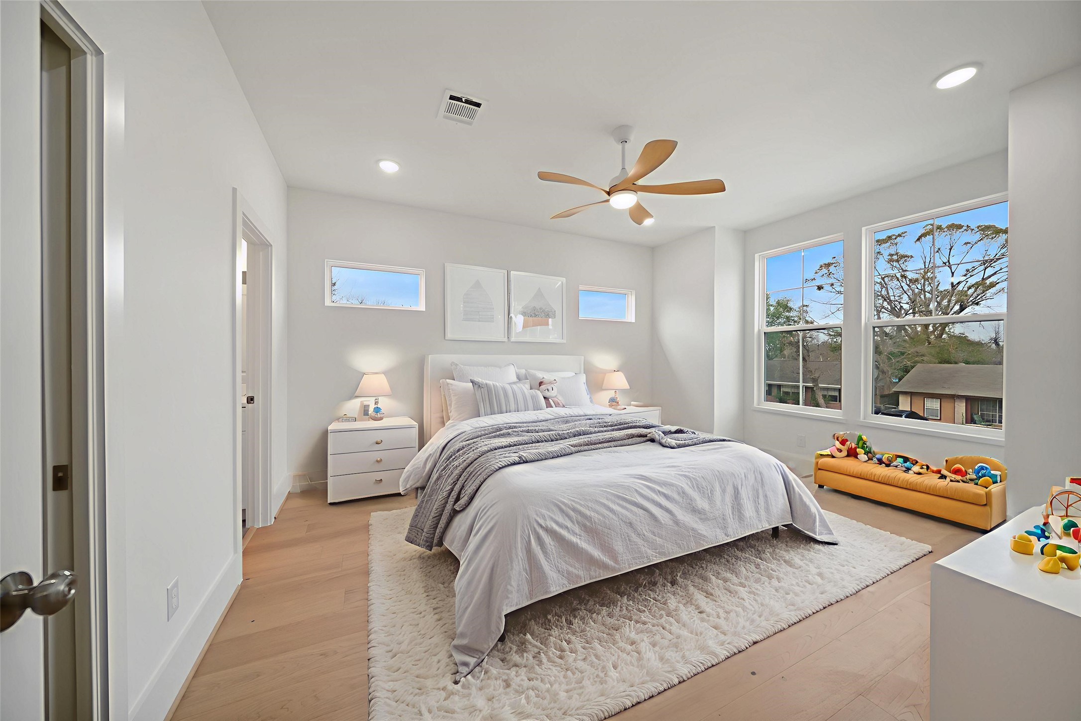 8521 Friendship Road Houston, TX 77080 - Photo 37 of 49 a bedroom with a bed and a chandelier