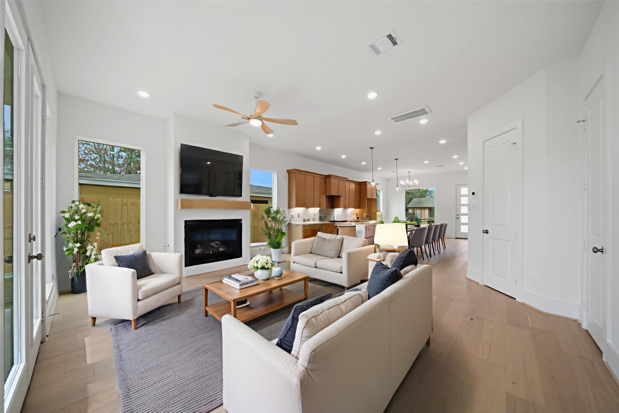 8521 Friendship Road Houston, TX 77080 - Photo 4 of 49 a living room with furniture a fireplace and a flat screen tv