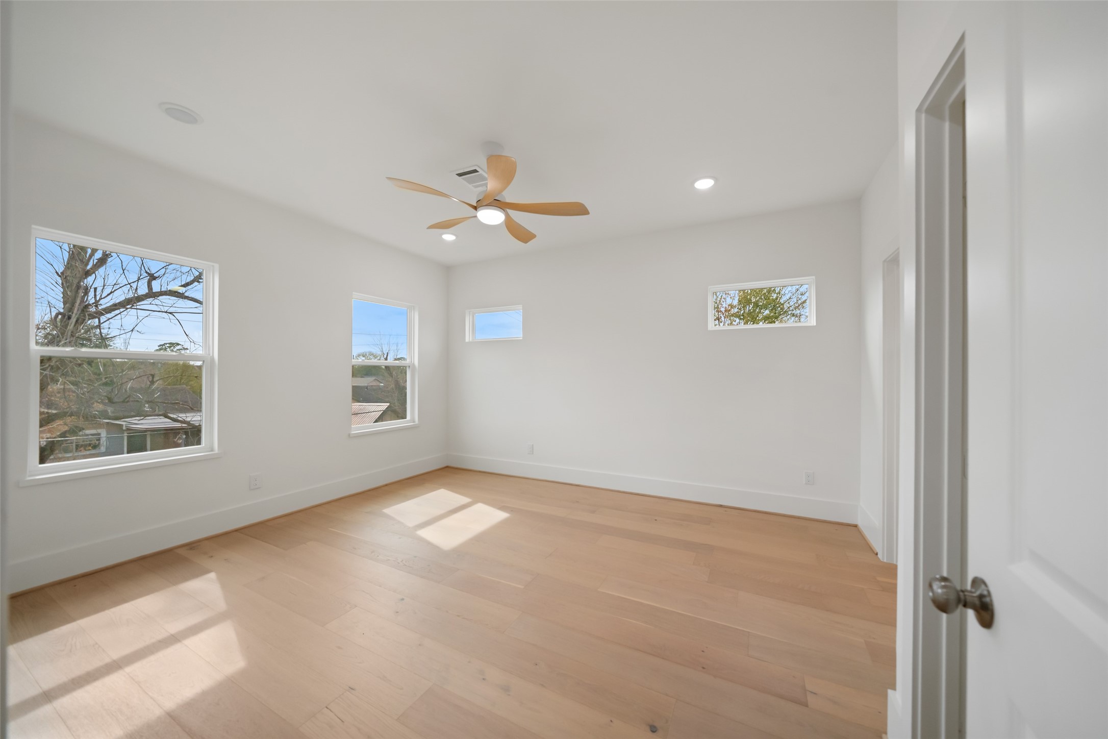 8521 Friendship Road Houston, TX 77080 - Photo 42 of 49 wooden floor in an empty room with a window
