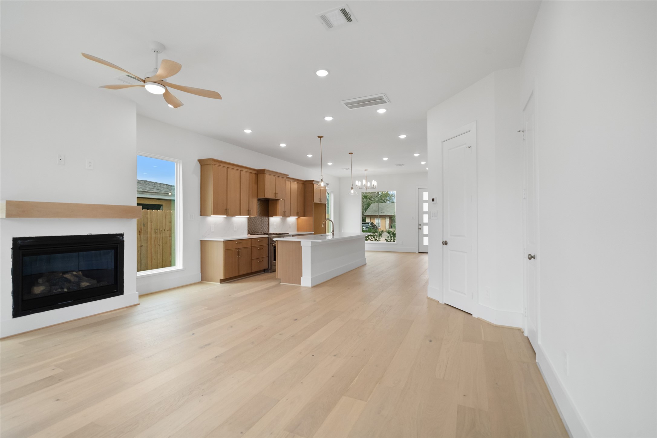 8521 Friendship Road Houston, TX 77080 - Photo 8 of 49 a view of a kitchen with a sink and a fireplace