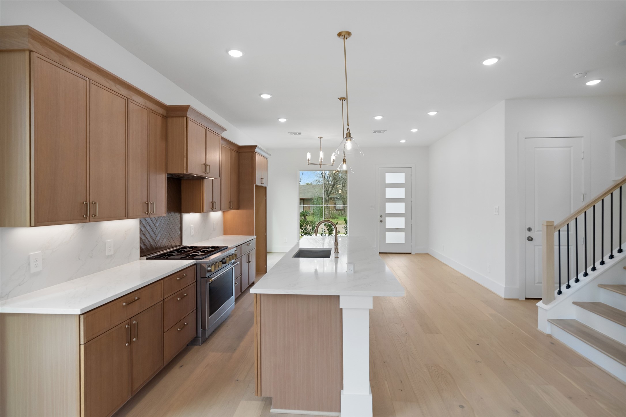 8521 Friendship Road Houston, TX 77080 - Photo 10 of 49 a large kitchen with stainless steel appliances granite countertop a large stove a sink and a refrigerator