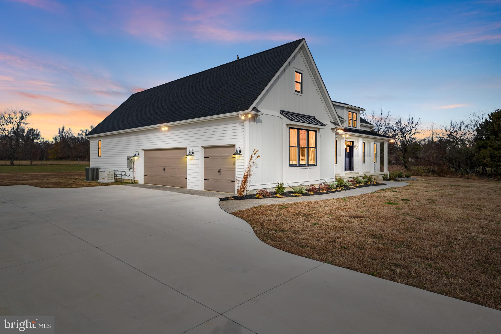 Three (3) car garage with three Anderson windows