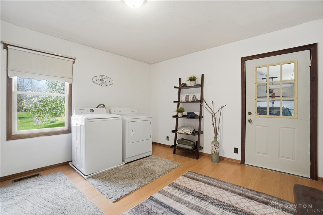 7553 Coffin Station Road Springfield, OH 45502 - Photo 59 of 95 This bright laundry area combines functionality with views of the outdoors.