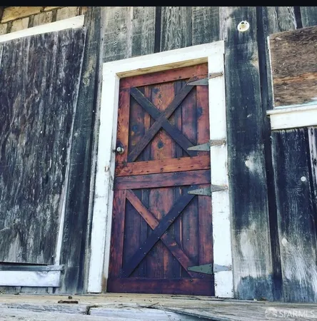 a bathroom with a glass door and a shower