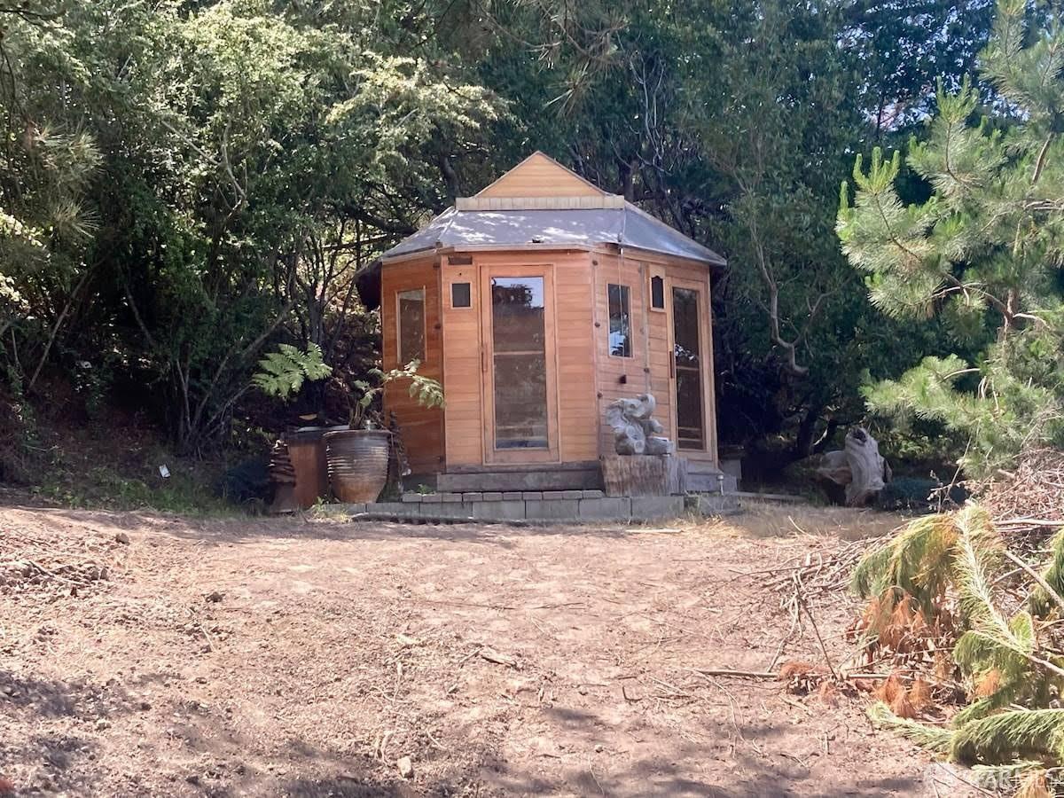 5631 Cloverdale Road Pescadero, CA 94060 - Photo 4 of 19 a front view of a house with a yard