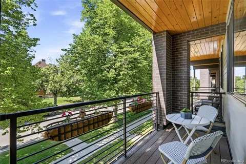 a view of a balcony with chairs