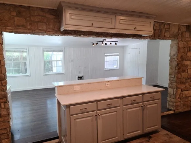 a room with cabinets and wooden floor