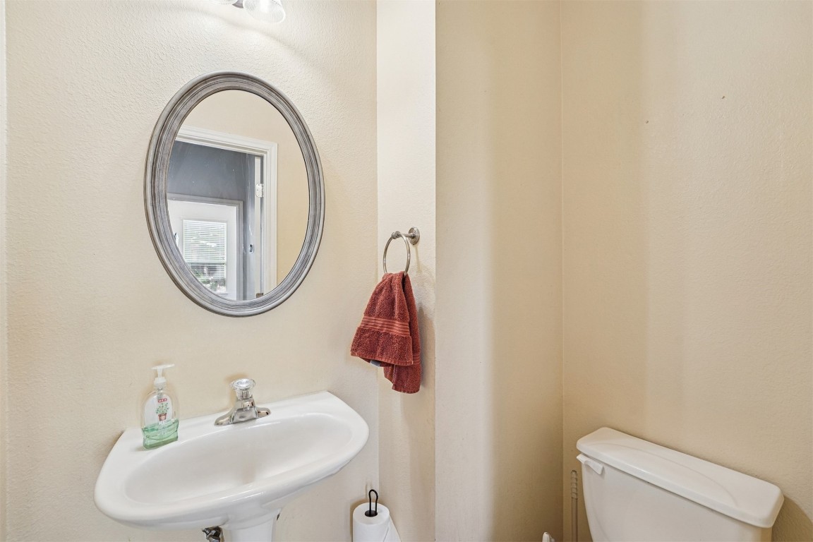 2301 Ambling Trail Pflugerville, TX 78660 - Photo 13 of 34 a bathroom with a toilet and a sink