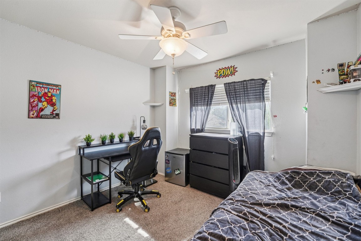 2301 Ambling Trail Pflugerville, TX 78660 - Photo 18 of 34 a bedroom that has a bed and a chair in it