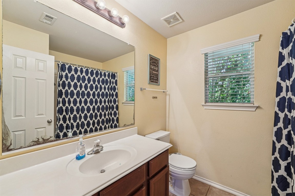 2301 Ambling Trail Pflugerville, TX 78660 - Photo 20 of 34 a bathroom with a sink and a toilet