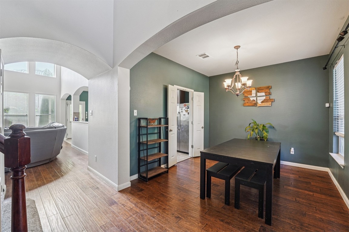 2301 Ambling Trail Pflugerville, TX 78660 - Photo 4 of 34 a view of a dining room with furniture window and wooden floor