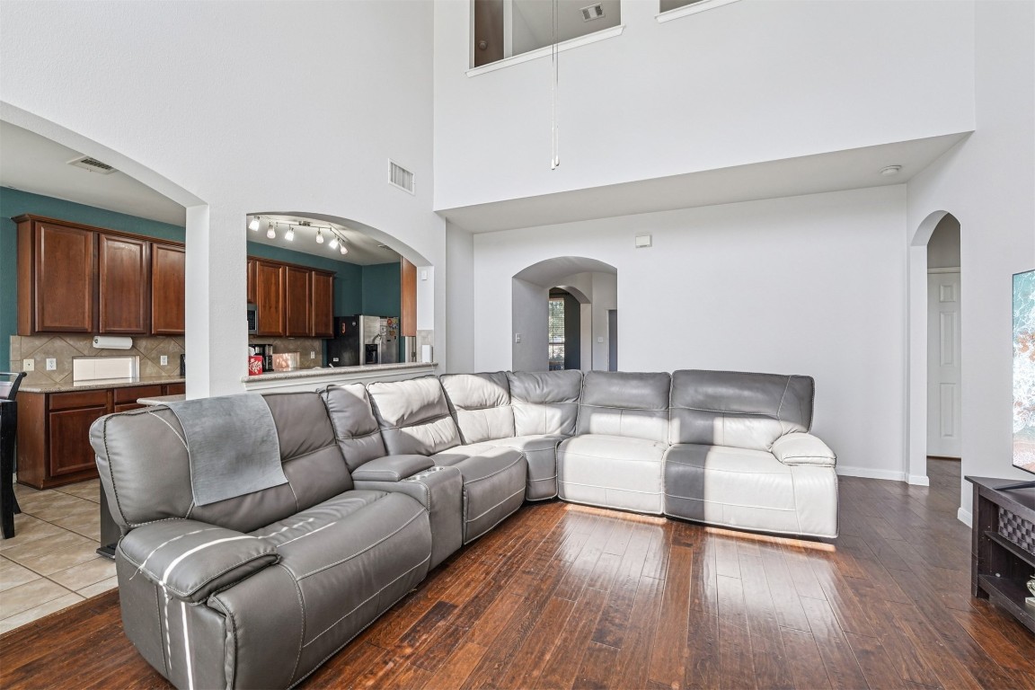 2301 Ambling Trail Pflugerville, TX 78660 - Photo 7 of 34 a living room with furniture and a wooden floor