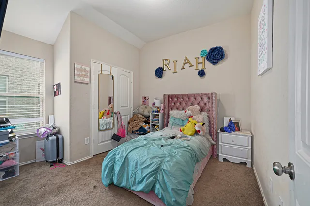 a bed room with a bed and a couch