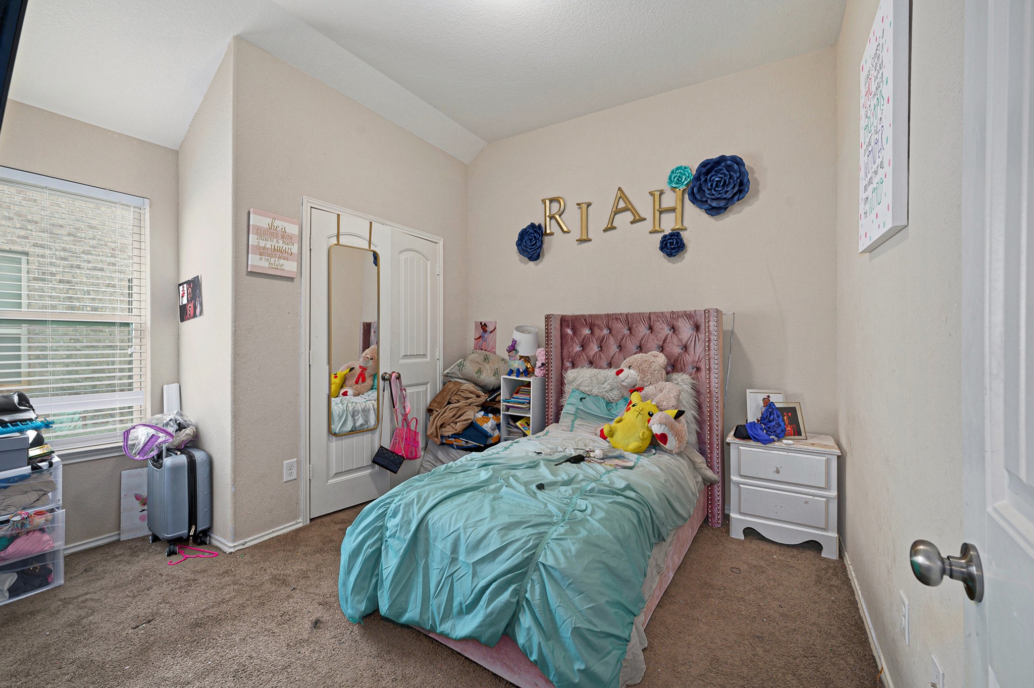 20719 Winghaven Drive Katy, TX 77449 - Photo 16 of 22 a bed room with a bed and a couch